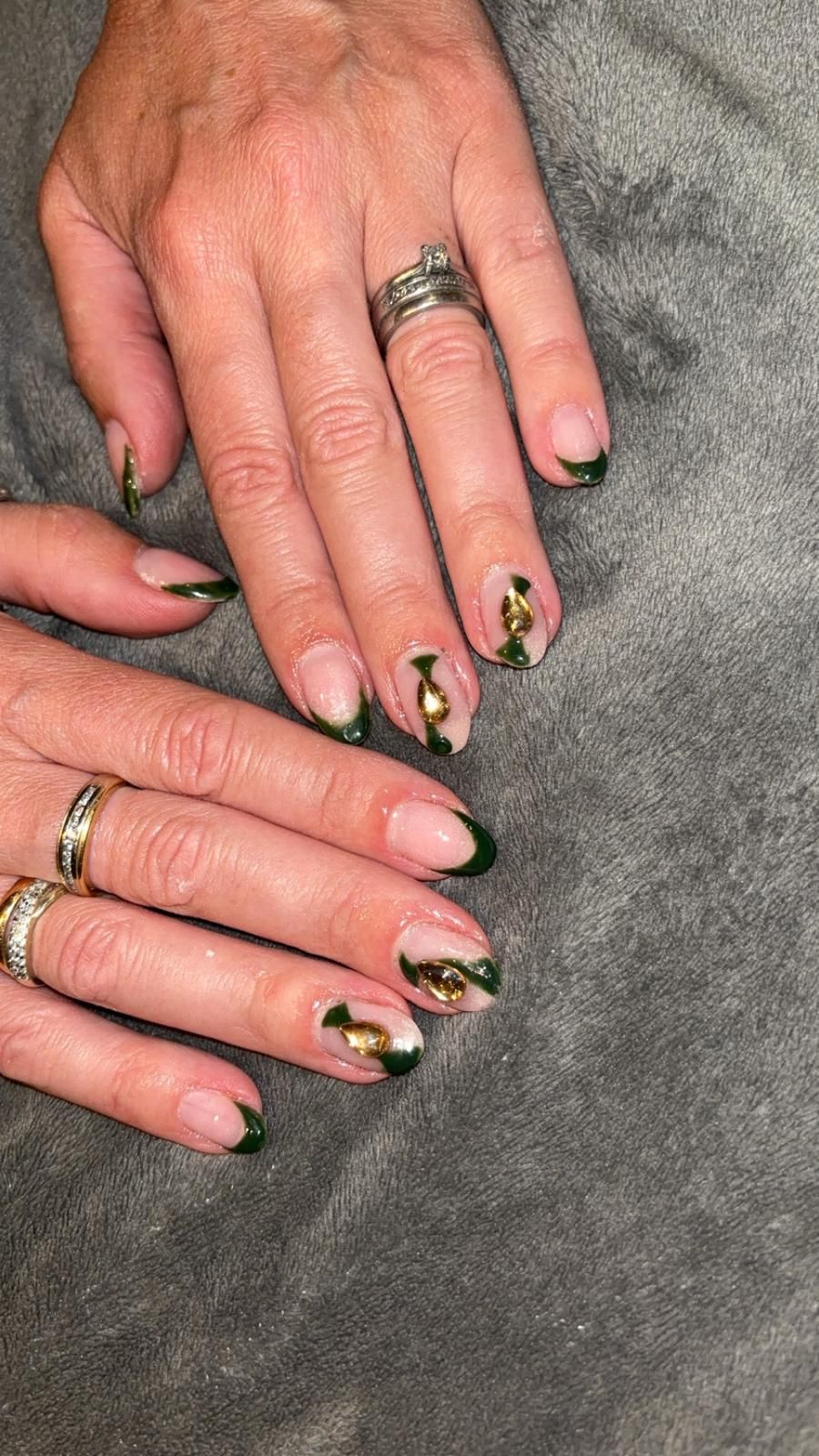 Forest green French manicure with gold accents