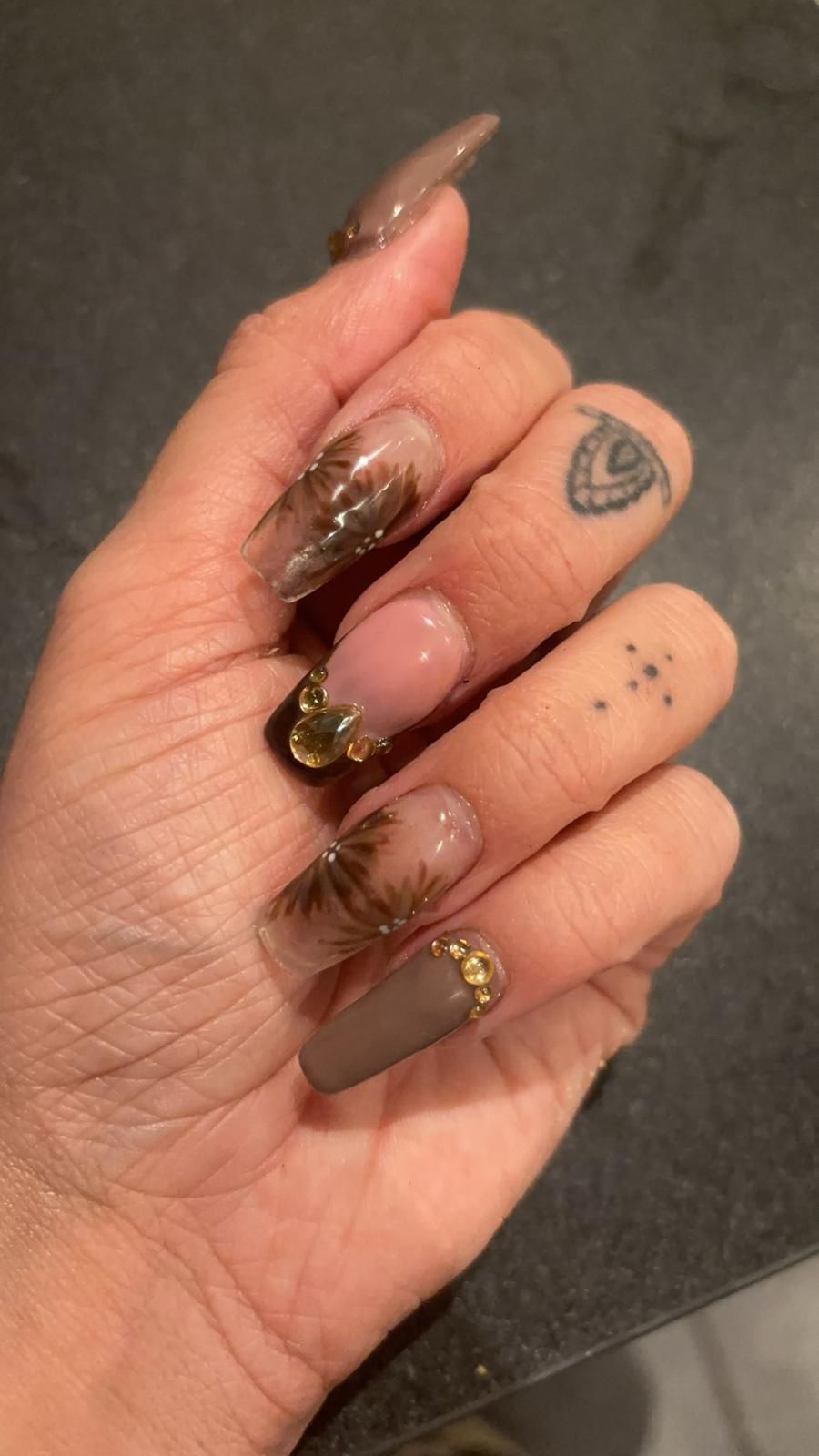Mocha coffin nails with hand-painted florals and gold gems